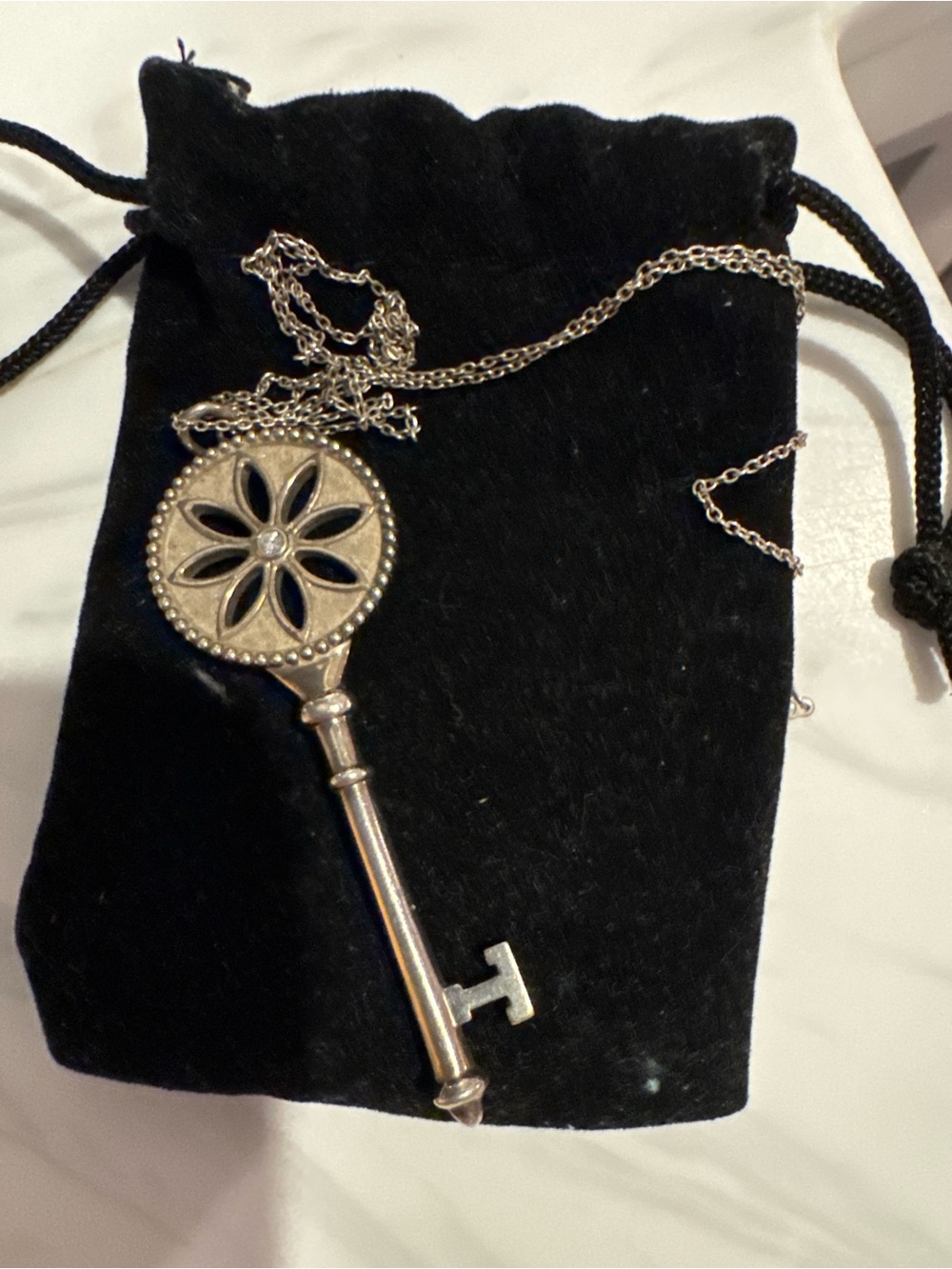 Tiffany & Co. Silver Key Pendant Necklace with Floral Motif